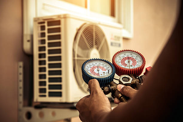 Professional Air Conditioning Service technician working in Pottsville, AR